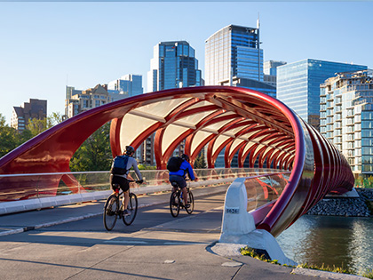 Two cyclist passing through Peace bridge.